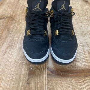 Black and Gold Men's Sneakers pre owned with wear please look at pictures.